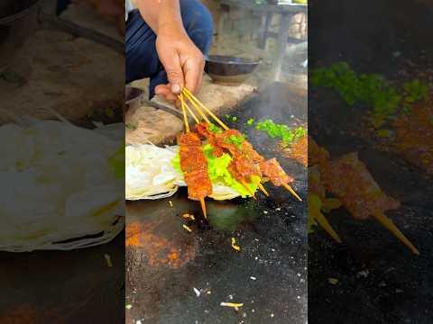 Chinese burger Grilled meat on stone slab