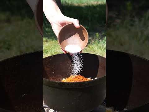 A woman takes rhubarb and cooking an amazing sauce for meat