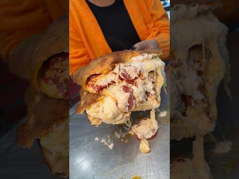 The CHEESY PEPPERONI CALZONE from Nuovo York Pizza in NYC’s East Village! 