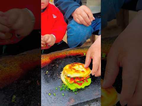 Chinese burger Fried fish tofu on stone slab